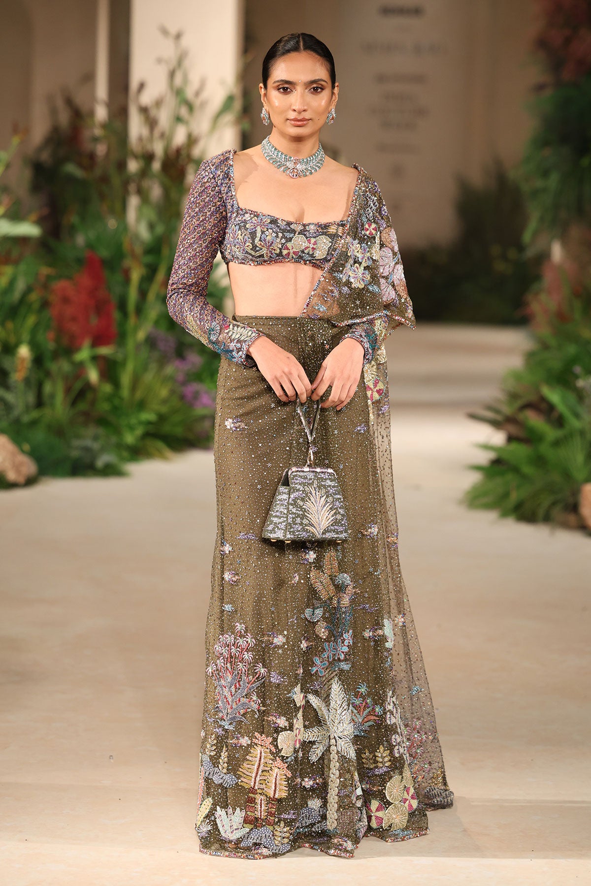 Bloomveil - Lush green gunmetal shimmer net drape saree