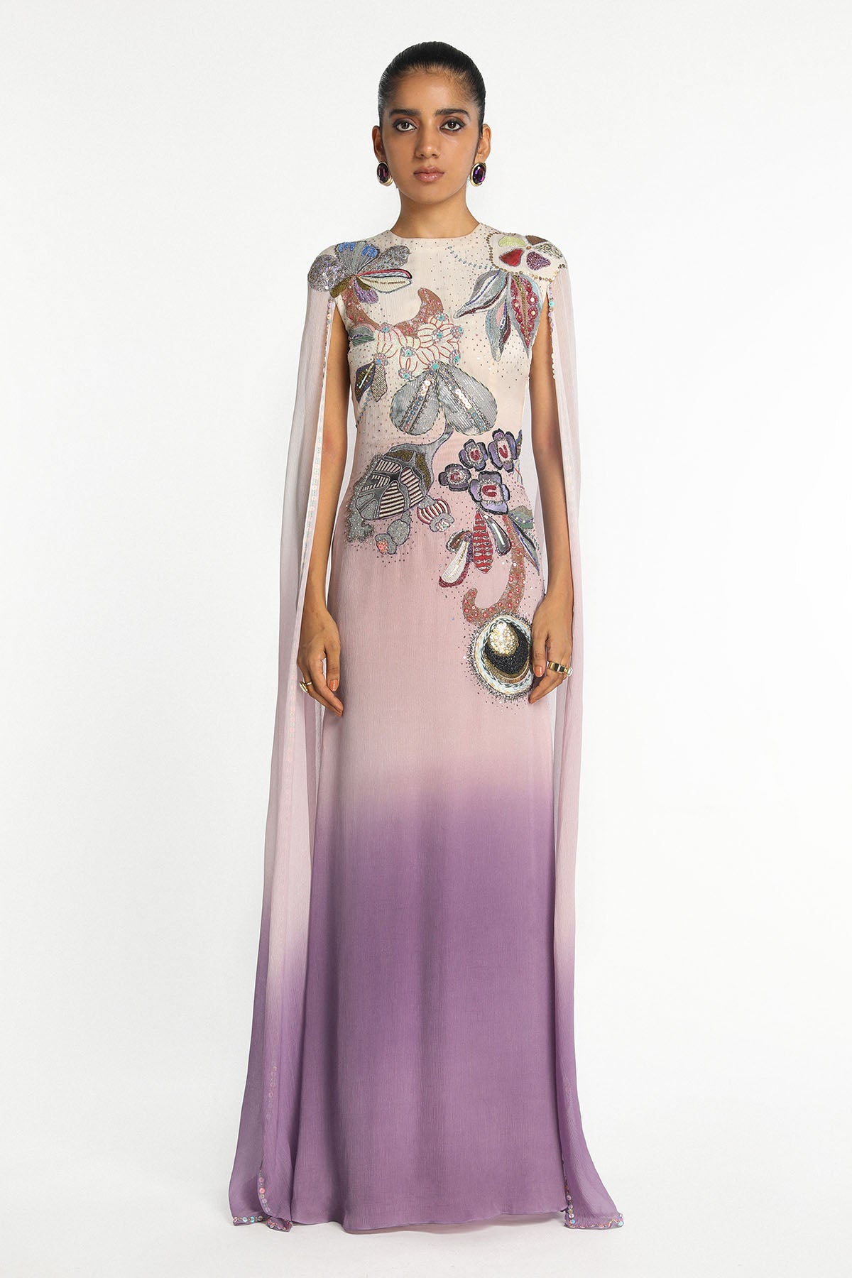 Woman wearing Kinfolk mist purple ombre chiffon gown with cape