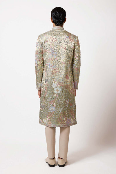 Close-up of sleeve embroidery and pleats left side view