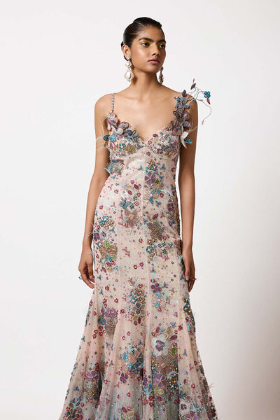 Woman in printed applique sequin lehenga right profile