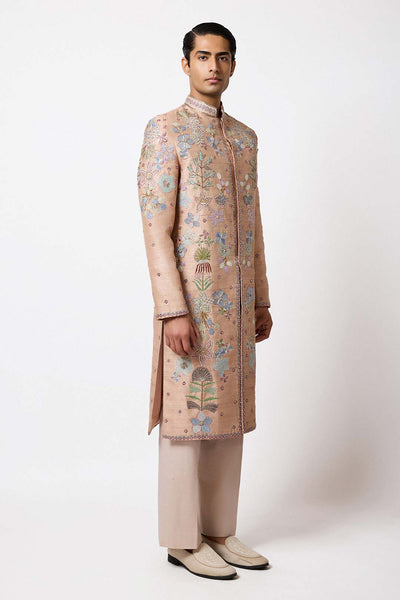 Left side view of Aisha Rao champagne sherwani for men