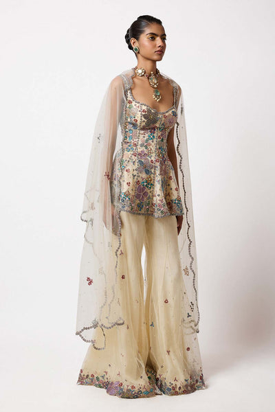 Woman wearing Aisha Rao ivory net short kurta front view