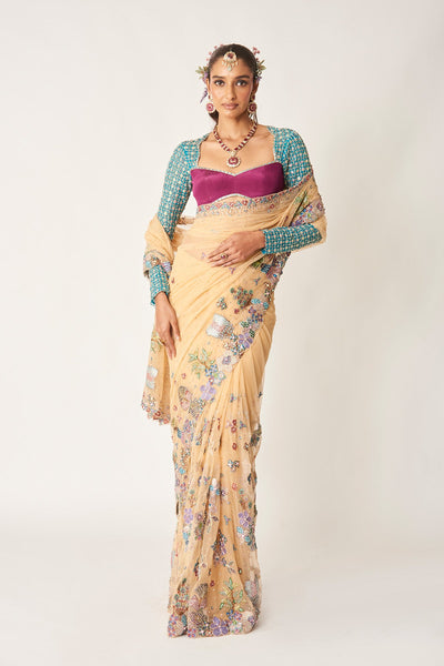 Woman in bisque tulle saree with full-sleeve blouse
