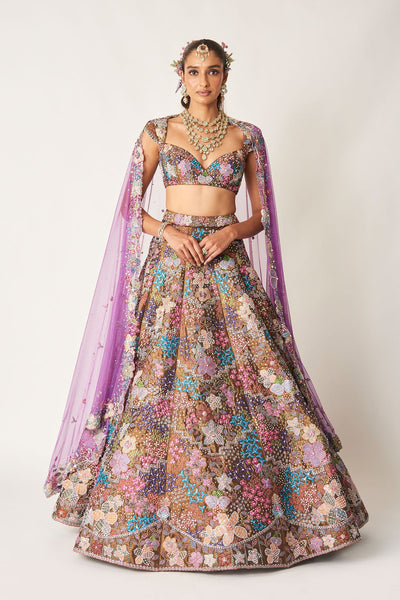 Woman wearing copper metallic embellished tissue lehenga