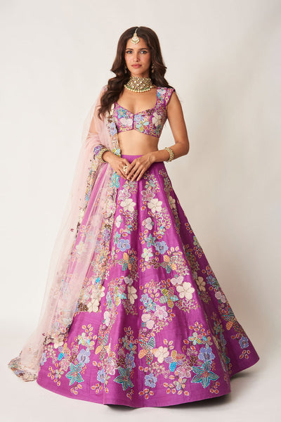 Woman wearing purple embellished raw silk lehenga