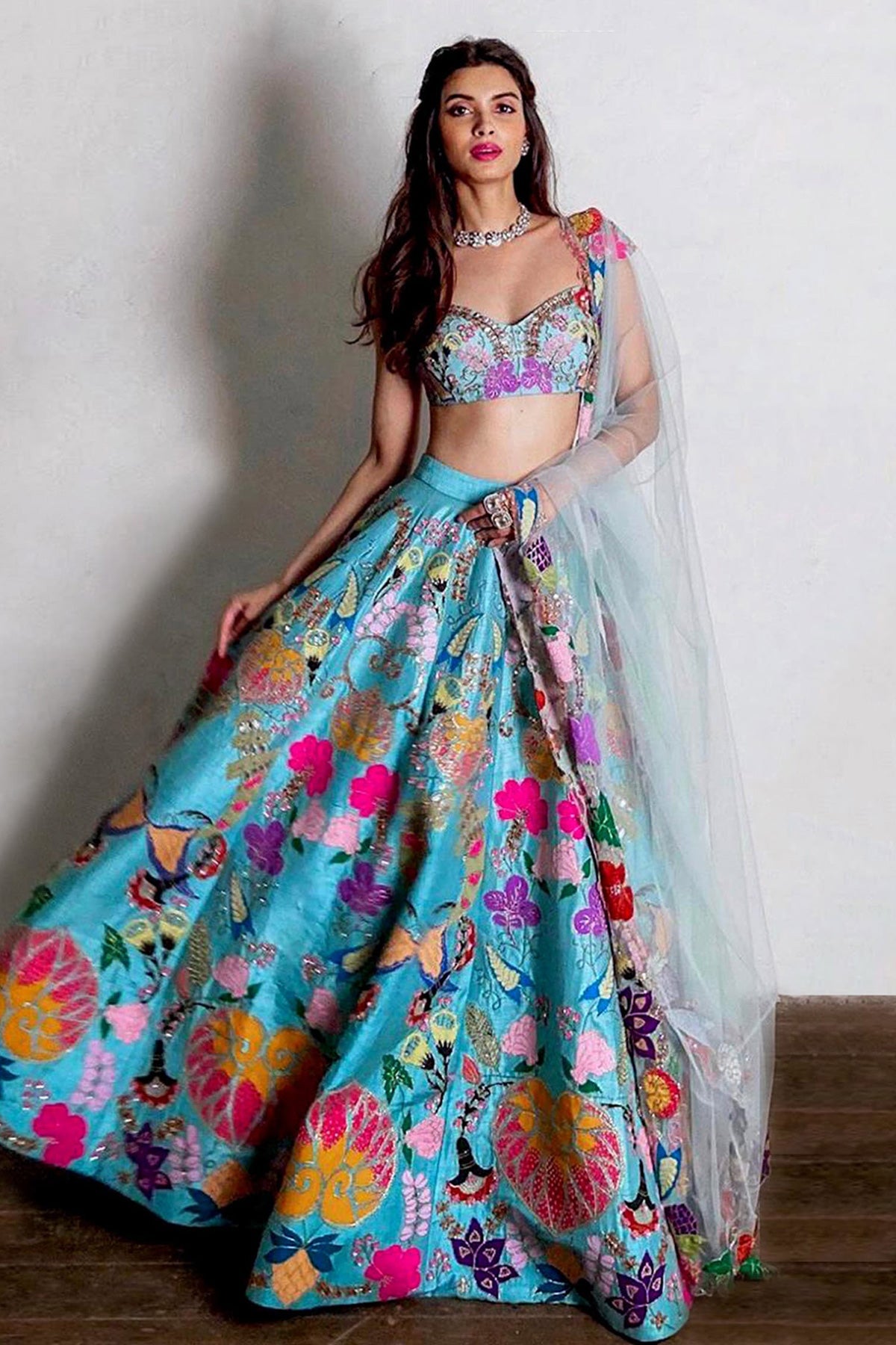 Woman wearing Aisha Rao Razzamatazz Scuba blue applique embellished raw silk