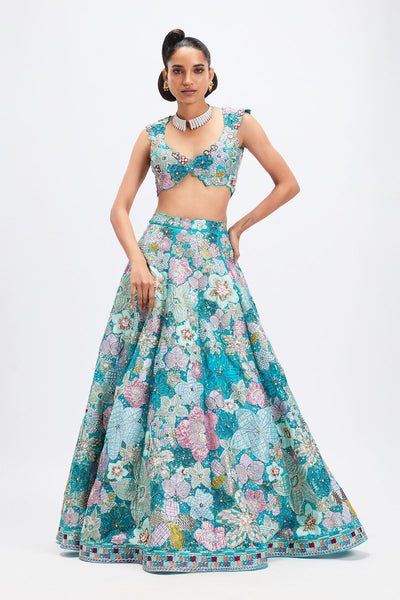 Woman in cyan blue floral applique lehenga
