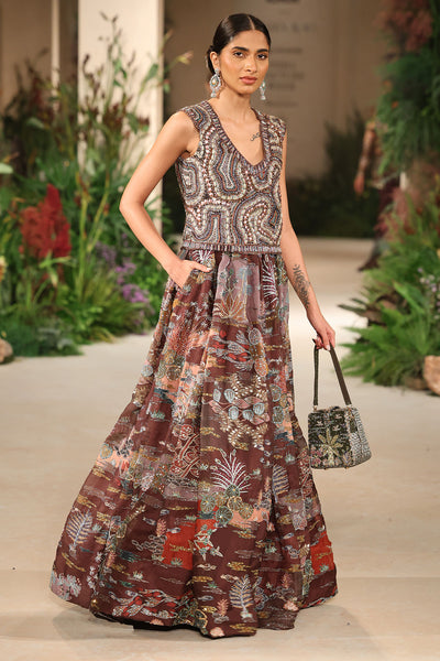 Side profile presenting the Wild At Heart teakberry organza lehenga with printed patterns and applique refinement