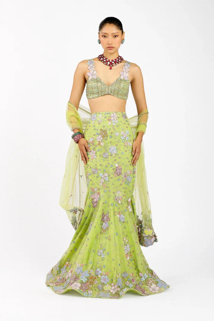 Woman wearing Matilda lime green mermaid lehenga set