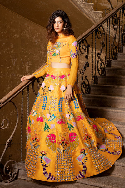 Side view of applique embellished yellow lehenga