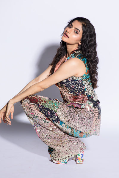 A full view of the multicolour maze sequined pantsuit with an embellished sleeveless jacket and wide leg pants.