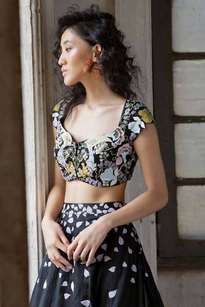 Detailed applique design on side of lehenga