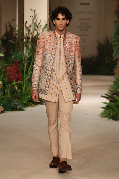 Applique detail from the Wild At Heart cantaloupe sandstone raw silk jacket showing artisanal embellished motifs