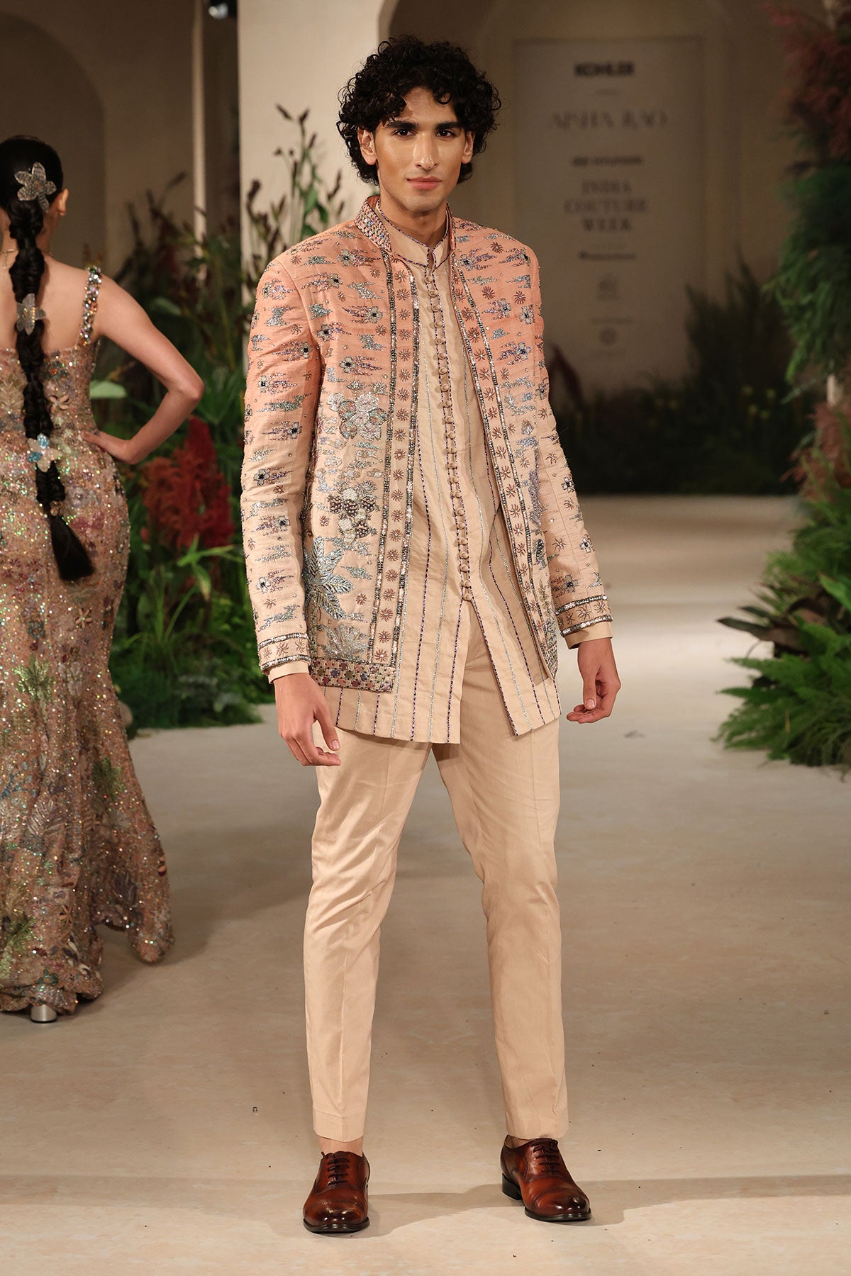 Detail composition capturing applique artistry, ombre texture, and raw silk refinement from the Wild At Heart jacket set