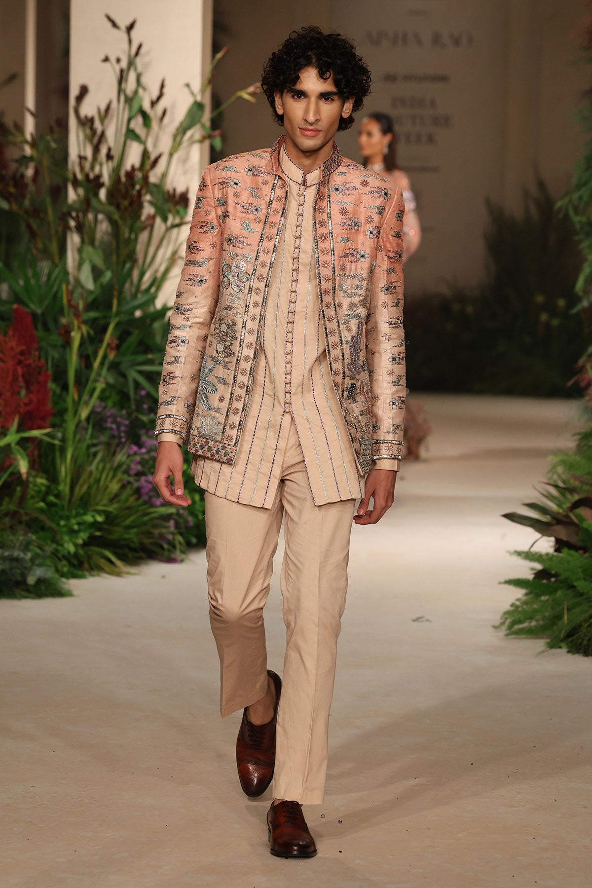 Styled look of the Wild At Heart cantaloupe sandstone ombre applique embellished raw silk jacket with satin kurta and cotton lycra pants