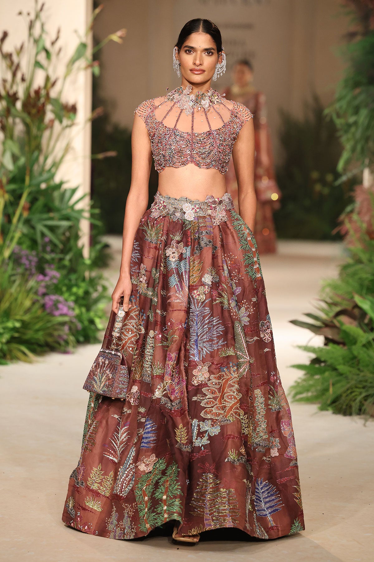 Front view of the Wild At Heart cantaloupe teakberry organza lehenga highlighting printed motifs and applique detailing
