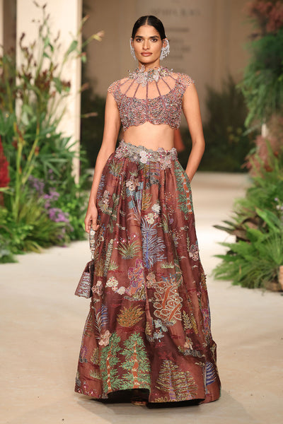 Print detail highlighting artistic cantaloupe and teakberry patterning from the Wild At Heart lehenga