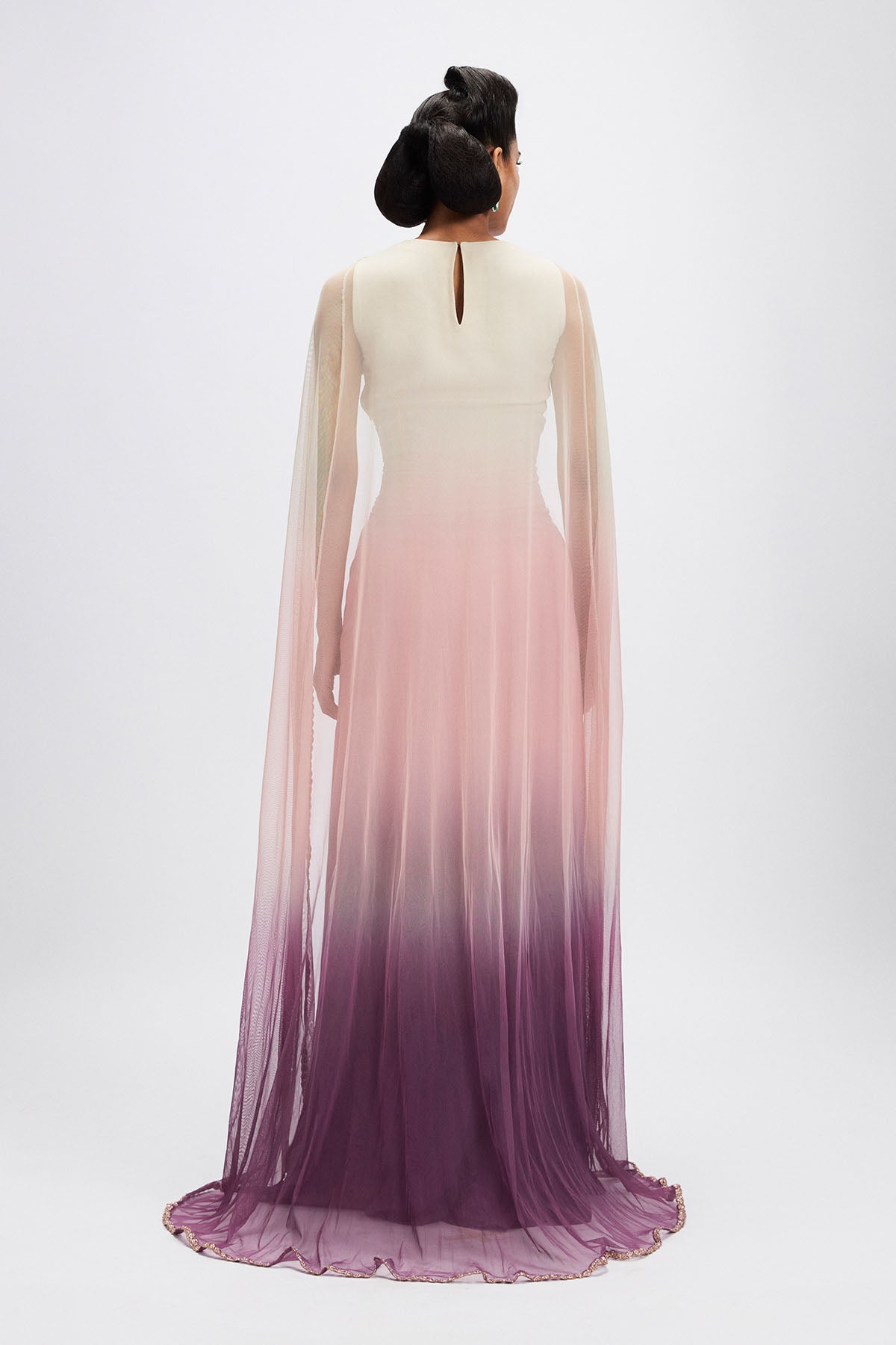 Rear view of dusk cape gown with embroidery