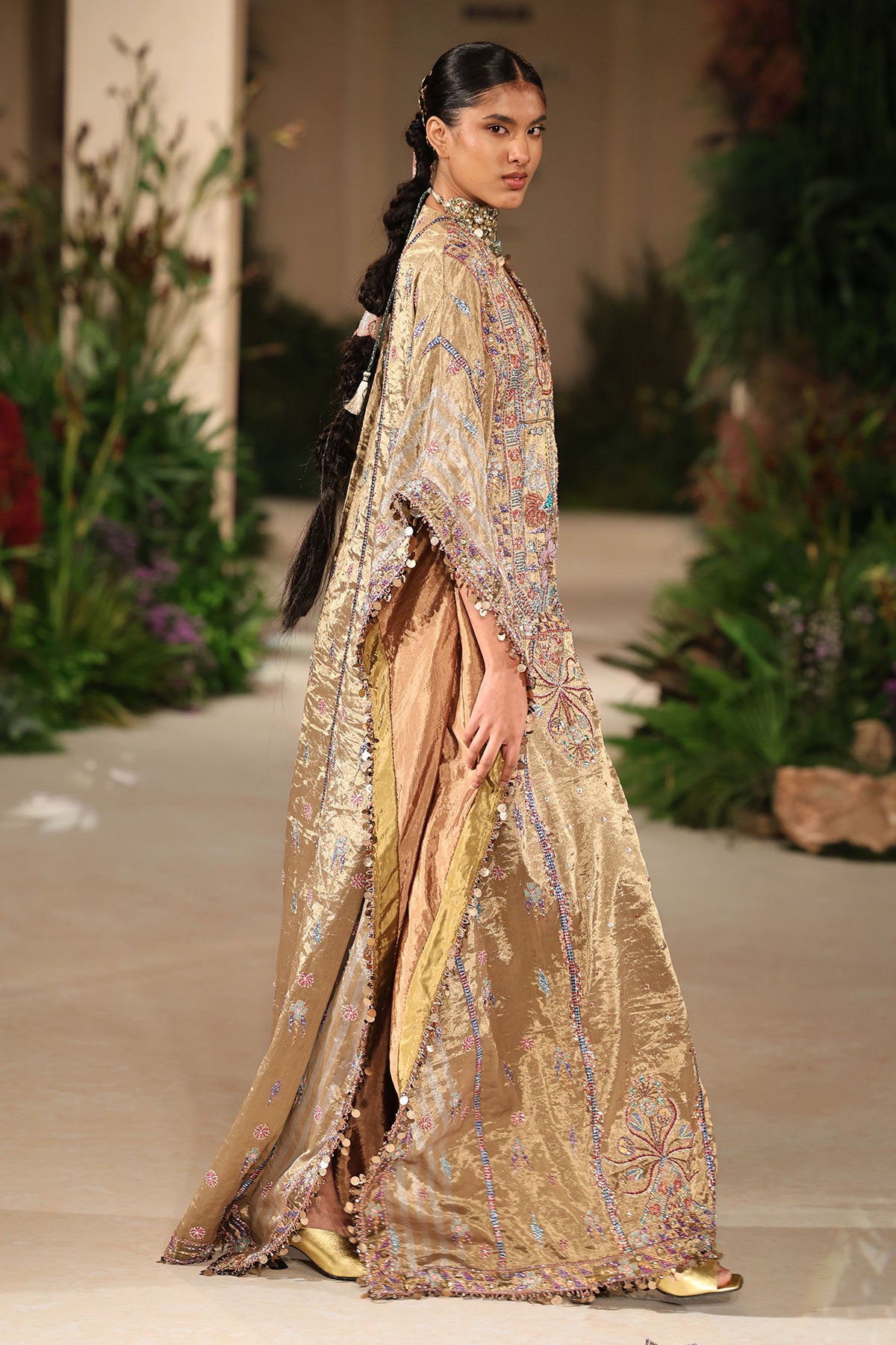 Wild At Heart golden brocade kaftan captured in motion showing shimmering tissue layers
