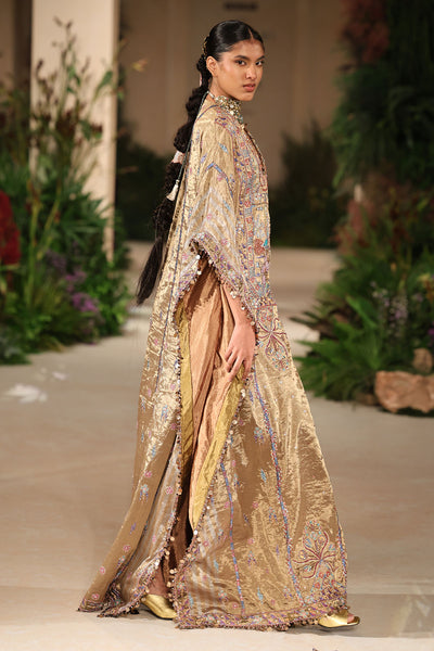 Wild At Heart golden brocade kaftan captured in motion showing shimmering tissue layers