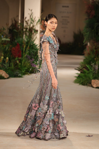 Closeup of the 3D floral appliqué crafted on the grey organza surface with embellished finesse