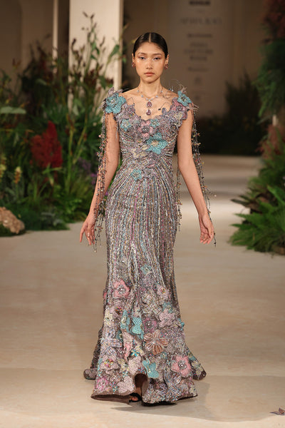 Full view of the grey applique embellished organza off shoulder fishtail gown adorned with beaded detailing and 3D flowers