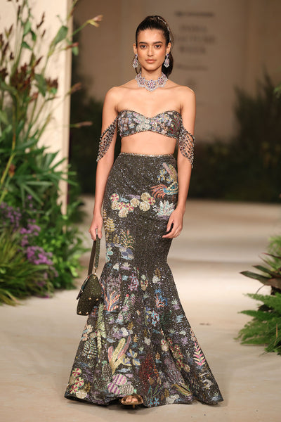 Front view of the gunmetal applique embellished tulle mermaid lehenga highlighting the crystal fringes and bead detailing