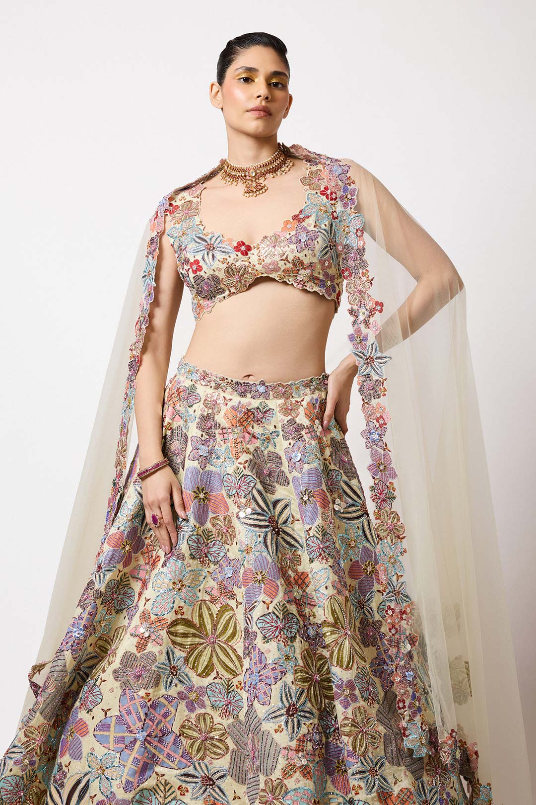Woman in ivory Kasab satin printed set right profile