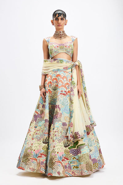Woman wearing Matilda ivory applique lehenga set