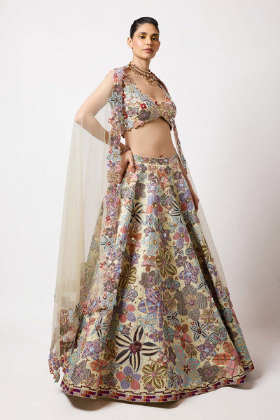 Woman wearing Aisha Rao ivory printed applique satin outfit