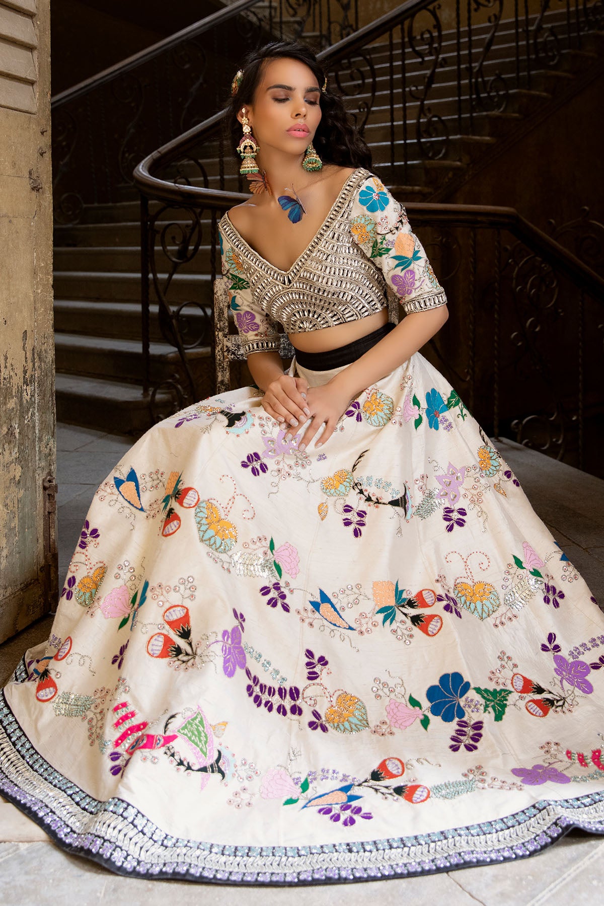 Side profile of ivory lehenga and blouse