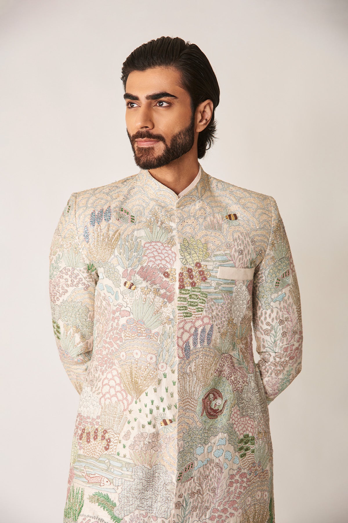 Close-up of applique embellished ivory sherwani