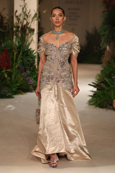 Wild At Heart light gold brocade gown captured in motion revealing shimmering brocade and applique detailing