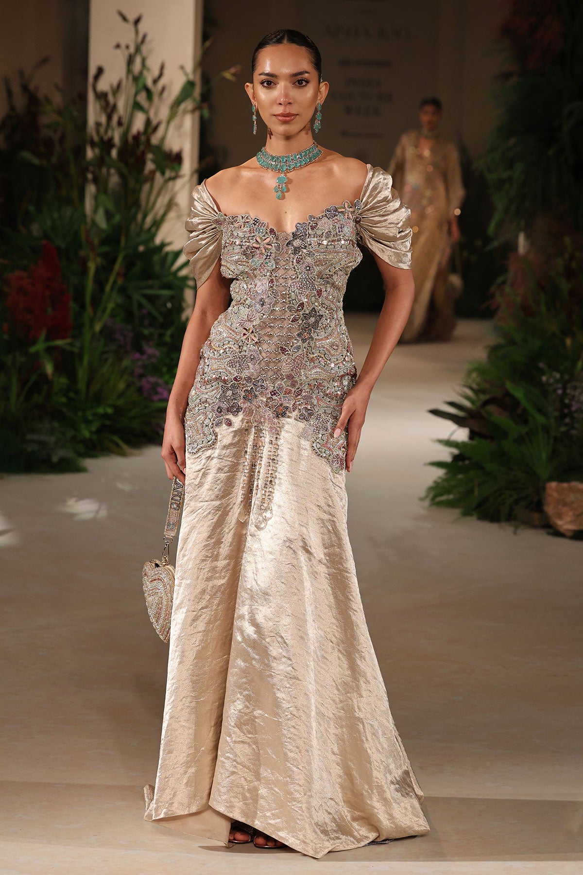 Flowing skirt detail showing the Wild At Heart light gold brocade gown’s elegant movement