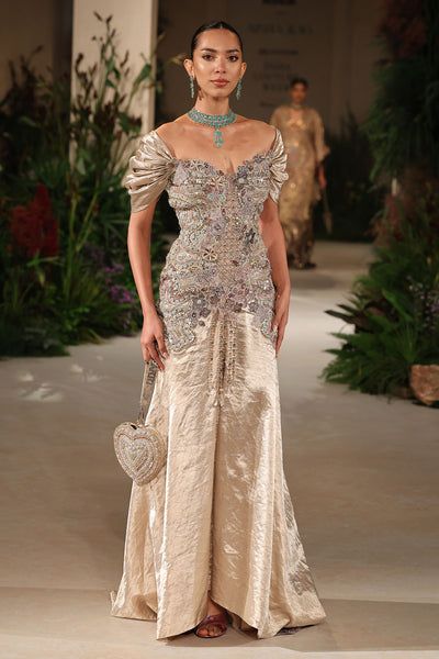 Closeup of the puffed sleeve showing embellished applique on the Wild At Heart light gold brocade gown