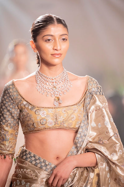 Back drape of the Wild At Heart applique embellished light gold banarasi brocade saree showcasing elegant tissue movement