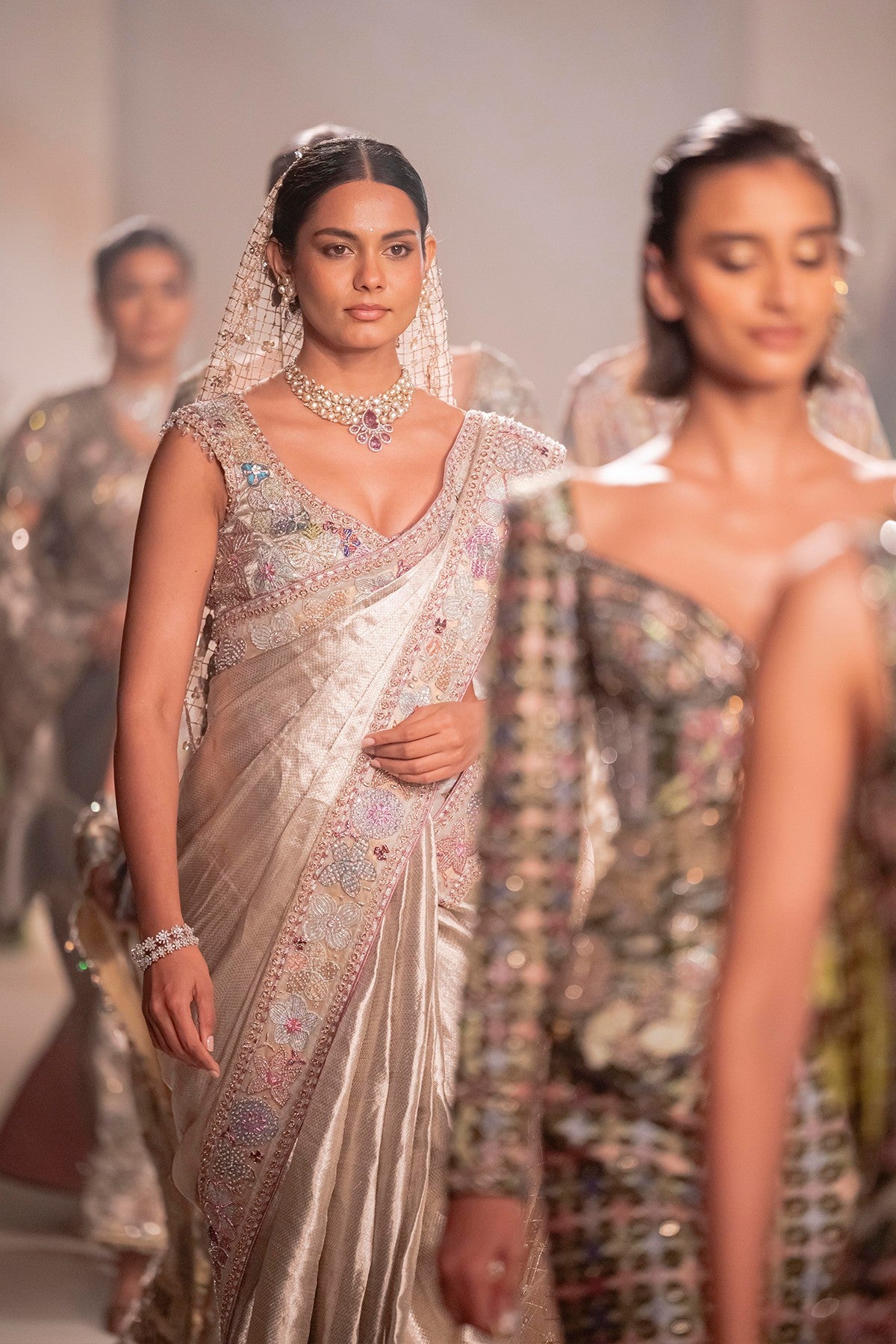 Pleats closeup showing the Wild At Heart light gold brocade motifs with fine embellishment