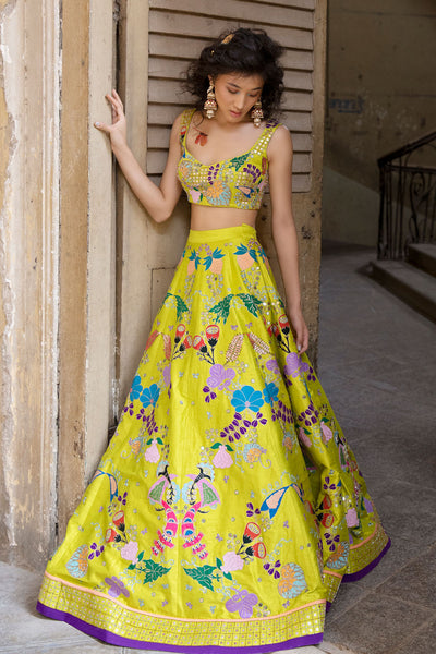 Side view of lime applique lehenga ensemble