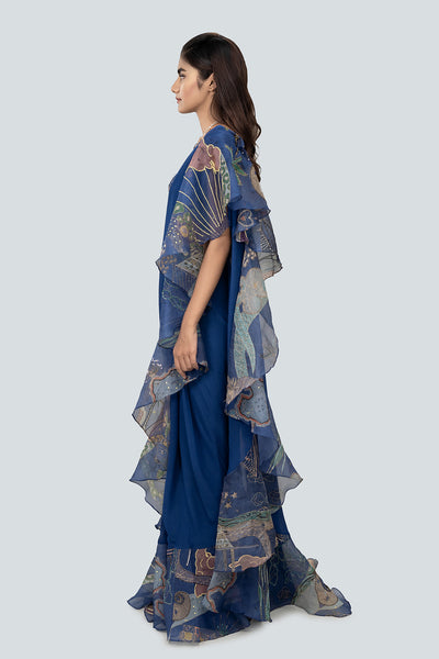 Flow of organza ruffle and saree pleats from side.