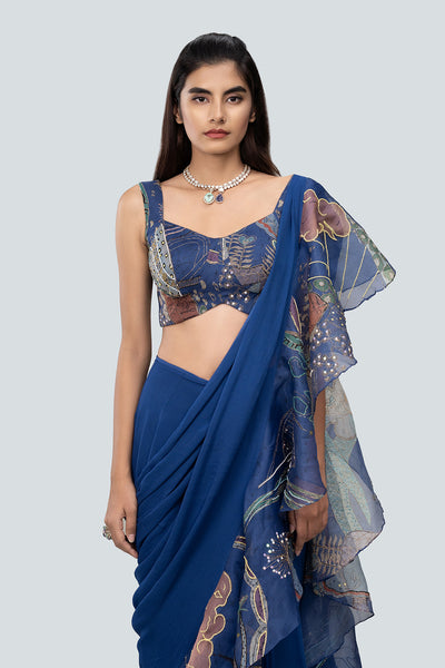 Close-up of embellished organza ruffle and blouse neckline.