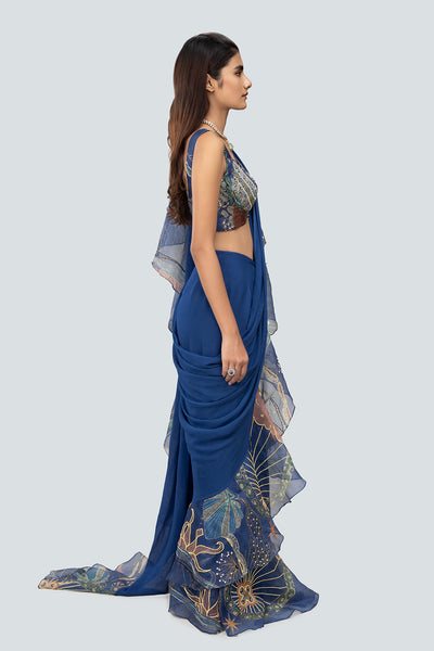 Draped organza ruffle and georgette pleats from right.