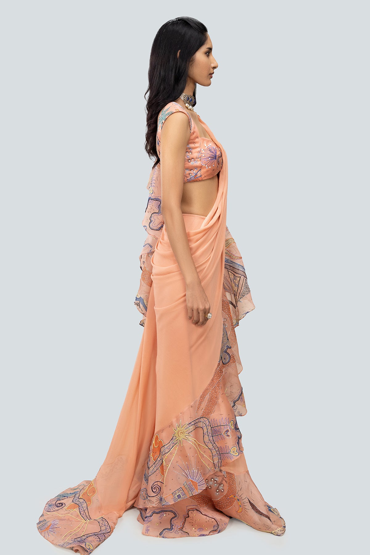 Draped organza ruffle and georgette saree pleats.