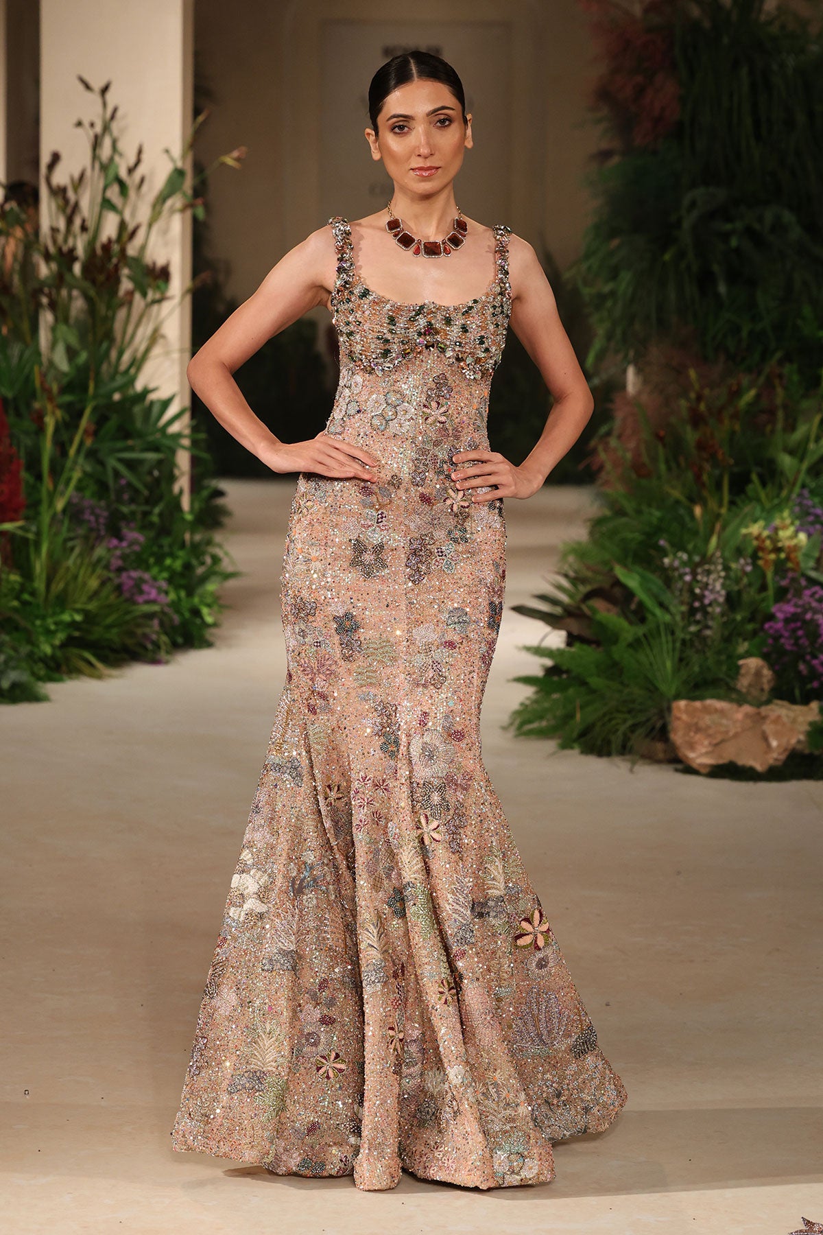Applique detail from the Wild At Heart peach sequin tulle gown featuring refined handcrafted floral motifs
