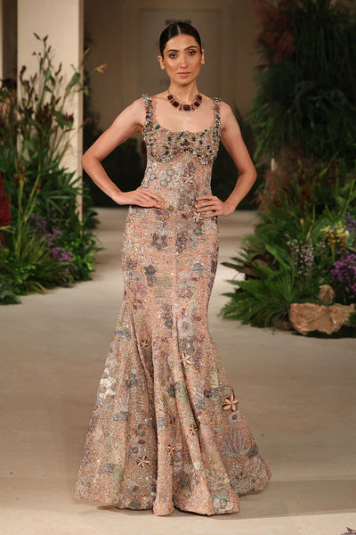 Applique detail from the Wild At Heart peach sequin tulle gown featuring refined handcrafted floral motifs