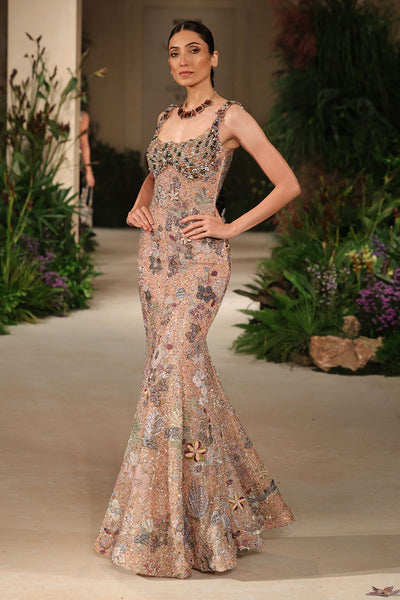 Front view of the Wild At Heart peach sequin tulle gown highlighting applique accents and the beaded crystal bodice