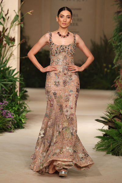 Hemline detail of the Wild At Heart peach tulle gown highlighting embellished edges and airy movement