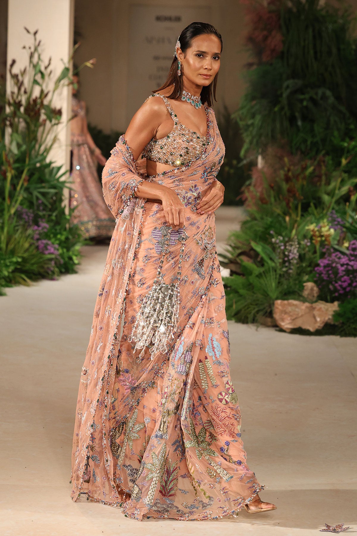 Front drape of the Wild At Heart peach embellished tulle saree highlighting applique artistry and soft fluidity