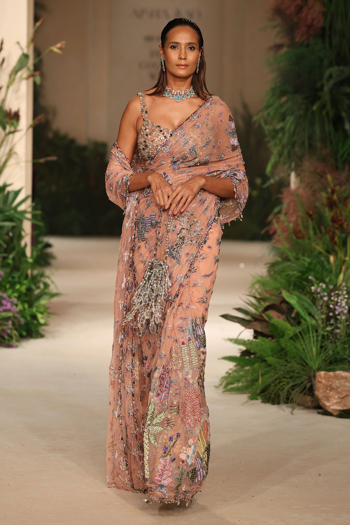 Wild At Heart peach tulle saree captured in motion showing soft applique shimmer and fluid elegance