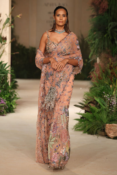 Wild At Heart peach tulle saree captured in motion showing soft applique shimmer and fluid elegance