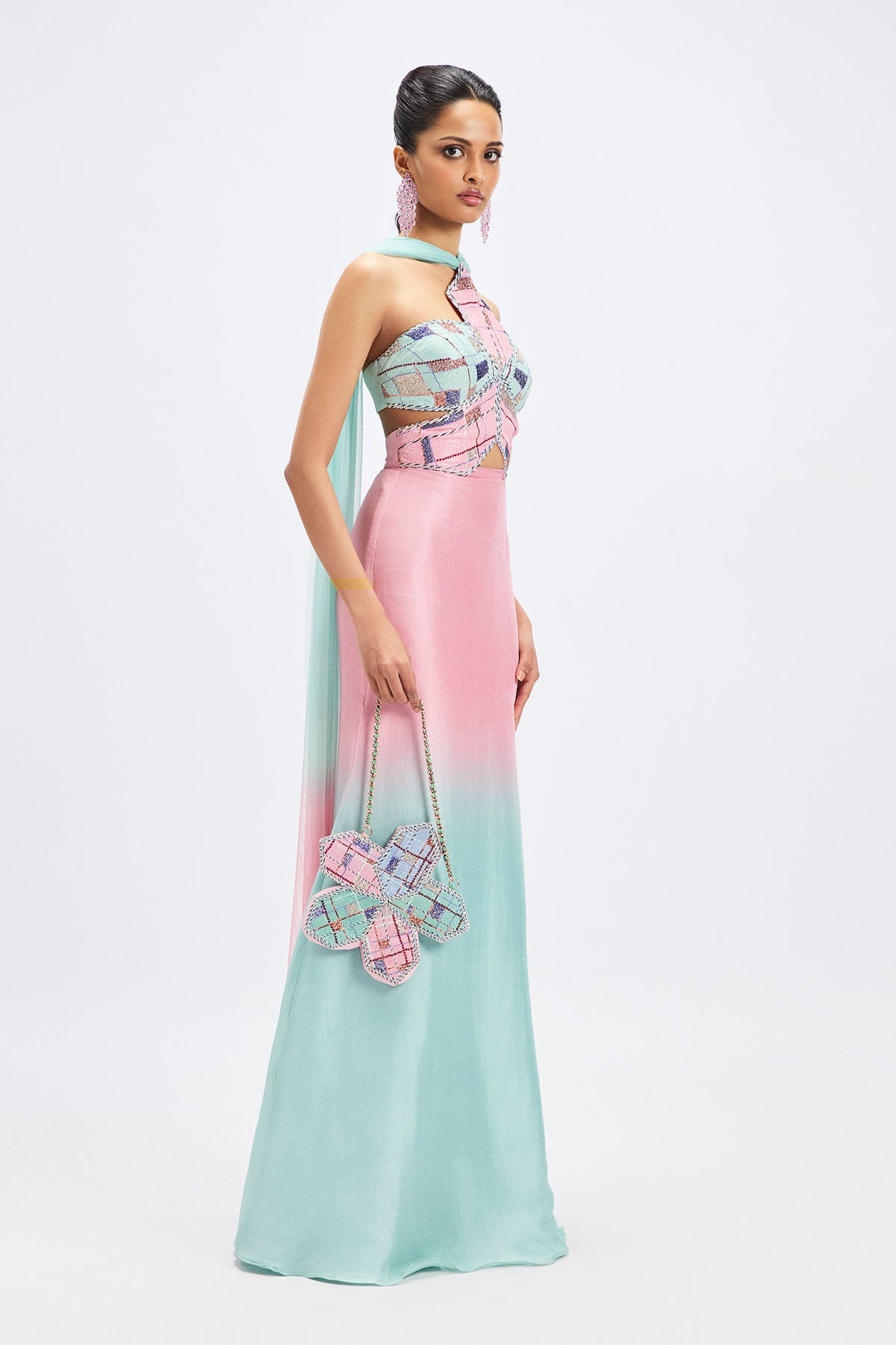 Flowing silhouette of pink aqua ombre gown side view